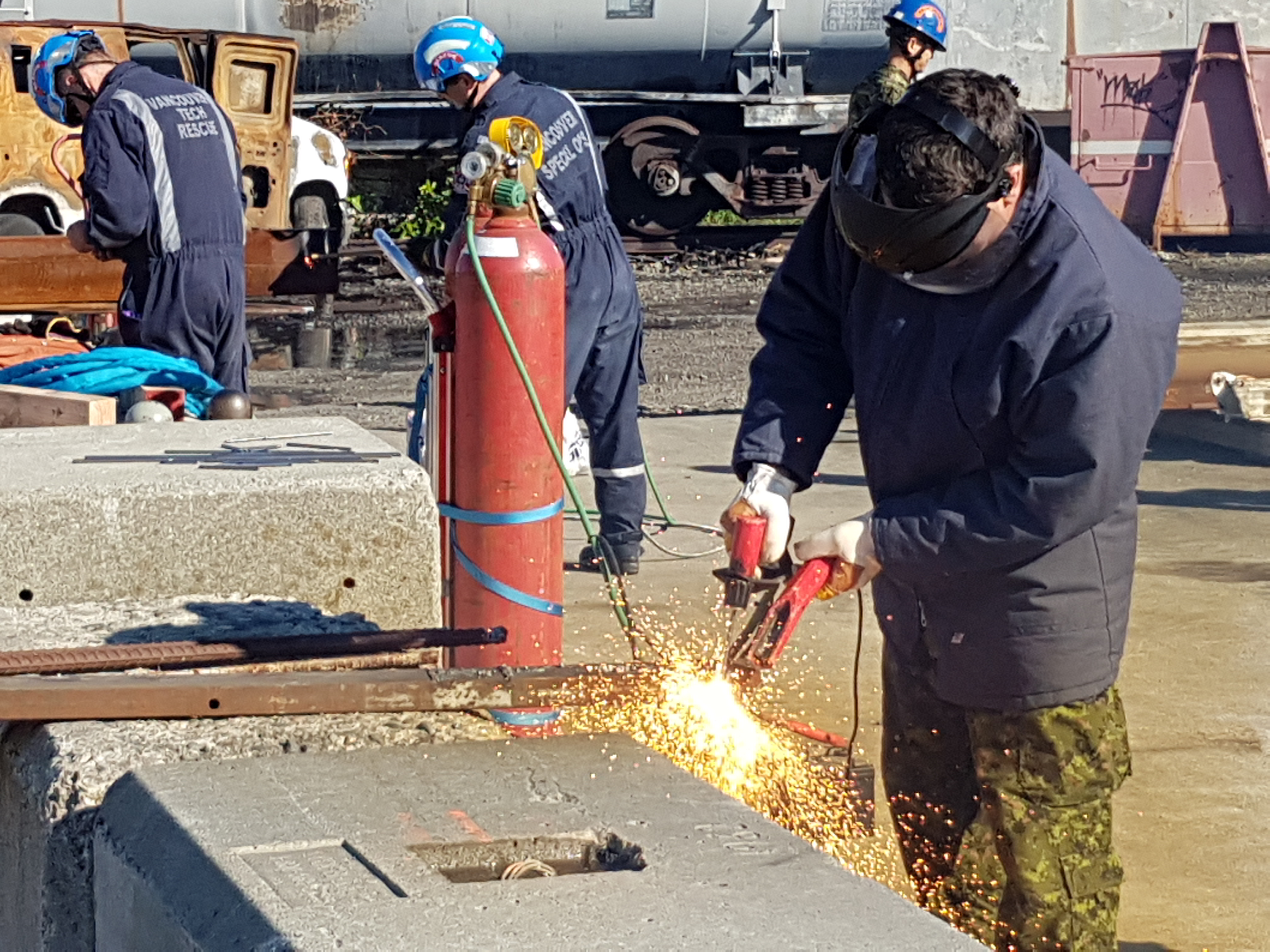 men working with power tools